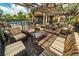 Relaxing community patio with shaded seating and a pergola at 160 Hideaway Beach Ln, Kissimmee, FL 34746