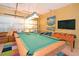 Game room with pool table, foosball, and seating area at 160 Hideaway Beach Ln, Kissimmee, FL 34746