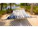 Relaxing hammock near lake at 160 Hideaway Beach Ln, Kissimmee, FL 34746