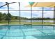 Inviting screened pool with lake view at 160 Hideaway Beach Ln, Kissimmee, FL 34746