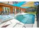 Large pool with patio and lounge chairs at 160 Hideaway Beach Ln, Kissimmee, FL 34746