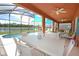 Outdoor dining area with table and chairs overlooking the pool at 160 Hideaway Beach Ln, Kissimmee, FL 34746