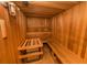Community sauna with wooden benches and heater at 160 Hideaway Beach Ln, Kissimmee, FL 34746
