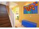 Dark wood staircase with white railing leading to upper level at 160 Hideaway Beach Ln, Kissimmee, FL 34746