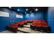 Community theater room with many red seats at 160 Hideaway Beach Ln, Kissimmee, FL 34746