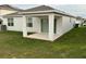 Covered patio extends from the back of the house, offering a shaded outdoor space at 1655 Aspen Ave, Davenport, FL 33837