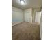 Spacious bedroom with neutral carpeting and double door closet at 1655 Aspen Ave, Davenport, FL 33837