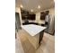Kitchen island with white quartz countertop and ample storage space at 1655 Aspen Ave, Davenport, FL 33837