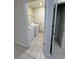 Laundry room with washer, dryer, and extra shelving at 1655 Aspen Ave, Davenport, FL 33837