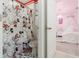 Bathroom with Minnie Mouse themed shower curtain and adjacent bedroom at 1829 Tropical Palms Cir Cir, Kissimmee, FL 34747