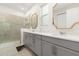 Elegant bathroom with double vanity, large shower, and modern fixtures at 1829 Tropical Palms Cir Cir, Kissimmee, FL 34747