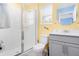 Cheerful bathroom with gray vanity and a shower stall at 1829 Tropical Palms Cir Cir, Kissimmee, FL 34747