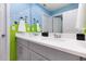 Toy Story themed bathroom with double vanity and gray cabinets at 1829 Tropical Palms Cir Cir, Kissimmee, FL 34747