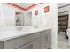 Double vanity bathroom with gray cabinets and a Mickey Mouse theme at 1829 Tropical Palms Cir Cir, Kissimmee, FL 34747