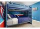 Bedroom with bunk bed and Marvel themed wall art at 1829 Tropical Palms Cir Cir, Kissimmee, FL 34747