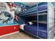 Bedroom with a bunk bed and a Marvel superhero mural at 1829 Tropical Palms Cir Cir, Kissimmee, FL 34747