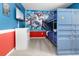 Bedroom with bunk beds, Marvel mural, and dresser at 1829 Tropical Palms Cir Cir, Kissimmee, FL 34747