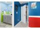 Hallway connecting bathroom and bedroom with blue and red walls at 1829 Tropical Palms Cir Cir, Kissimmee, FL 34747