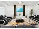 Bright living room with large TV, stylish decor, and ample natural light at 1829 Tropical Palms Cir Cir, Kissimmee, FL 34747