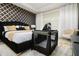 Main bedroom with a black velvet bed, gold decor, and a travel crib at 1829 Tropical Palms Cir Cir, Kissimmee, FL 34747