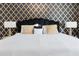 Main bedroom showcasing a luxurious bed with gold and black accents at 1829 Tropical Palms Cir Cir, Kissimmee, FL 34747