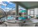 Outdoor patio with pool views, wicker furniture, and a dining area at 1829 Tropical Palms Cir Cir, Kissimmee, FL 34747