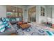 Relaxing outdoor patio with comfortable seating and a large rug at 1829 Tropical Palms Cir Cir, Kissimmee, FL 34747