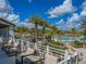 View of resort-style pool with lounge chairs, palm trees, and a partly cloudy sky at 1829 Tropical Palms Cir Cir, Kissimmee, FL 34747
