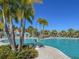 Relaxing resort-style pool with lounge chairs and palm trees at 1829 Tropical Palms Cir Cir, Kissimmee, FL 34747