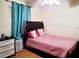 Bedroom with a full-size bed and teal curtains at 1855 Caralee Blvd # 2, Orlando, FL 32822