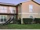 Two-story building with a spiral staircase and landscaping at 1855 Caralee Blvd # 2, Orlando, FL 32822