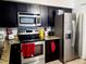 Modern kitchen with stainless steel appliances and granite countertops at 1855 Caralee Blvd # 2, Orlando, FL 32822