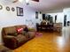 Open living and dining area with wood floors at 1855 Caralee Blvd # 2, Orlando, FL 32822