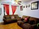 Living room with brown couches and wood flooring at 1855 Caralee Blvd # 2, Orlando, FL 32822