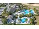 Aerial view of community pool, clubhouse, and palm trees at 1867 Flora Pass Pl, Kissimmee, FL 34747