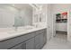 Modern bathroom with double vanity, walk-in shower and closet at 1867 Flora Pass Pl, Kissimmee, FL 34747