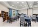 Bright community room with tables, chairs, and bookshelves at 1867 Flora Pass Pl, Kissimmee, FL 34747