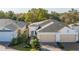 Two-story house with attached garage and walkway at 1867 Flora Pass Pl, Kissimmee, FL 34747