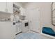 Laundry room with washer, dryer, and extra storage at 1867 Flora Pass Pl, Kissimmee, FL 34747