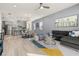 Open concept living and kitchen with gray cabinets and island at 1867 Flora Pass Pl, Kissimmee, FL 34747