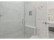 Walk-in shower with glass enclosure and built-in shelving at 1867 Flora Pass Pl, Kissimmee, FL 34747