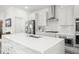 Modern kitchen with stainless steel appliances and white cabinets at 1867 Island Village Way, Celebration, FL 34747