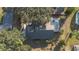 Aerial view of house, showing backyard, pool, and landscaping at 201 Steamboat Blvd, Davenport, FL 33897