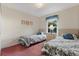 Bedroom with twin beds and floral bedding at 201 Steamboat Blvd, Davenport, FL 33897