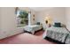Bedroom with twin beds and green bedding at 201 Steamboat Blvd, Davenport, FL 33897