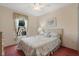 Bedroom with floral bedding and a ceiling fan at 201 Steamboat Blvd, Davenport, FL 33897