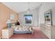 Main bedroom with floral bedding and pool view at 201 Steamboat Blvd, Davenport, FL 33897