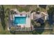 Community pool with lounge chairs and gazebo at 201 Steamboat Blvd, Davenport, FL 33897