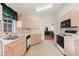 Kitchen with light-colored cabinets and appliances at 201 Steamboat Blvd, Davenport, FL 33897