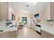 Kitchen with light-colored cabinets and appliances at 201 Steamboat Blvd, Davenport, FL 33897